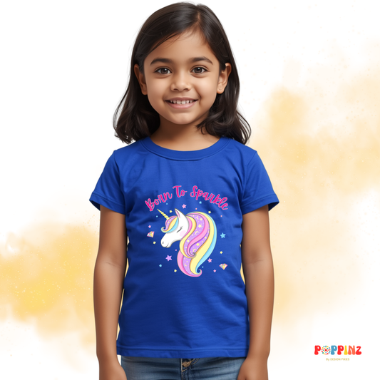 Young girl wearing a royal blue t-shirt with a unicorn design and text Born to Sparkle -Design Pixies